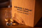 Drinks by the Dram Whisky Library box with a glass of whisky