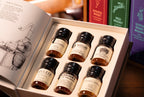 Bourbon book open with six wax-sealed drams